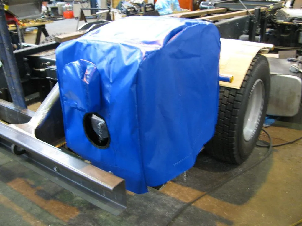 Heavy-duty blue PVC equipment cover on truck machinery