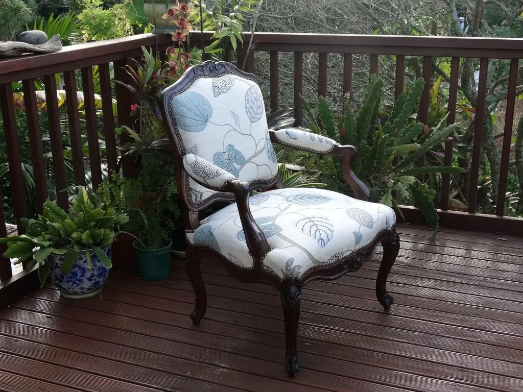 Antique armchair fully reupholstered in botanical linen fabric