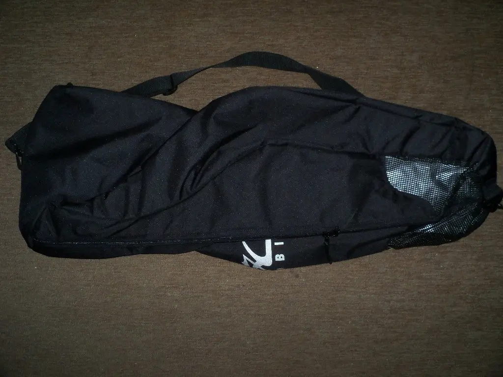 Black canvas kayak stowing bag with mesh panel