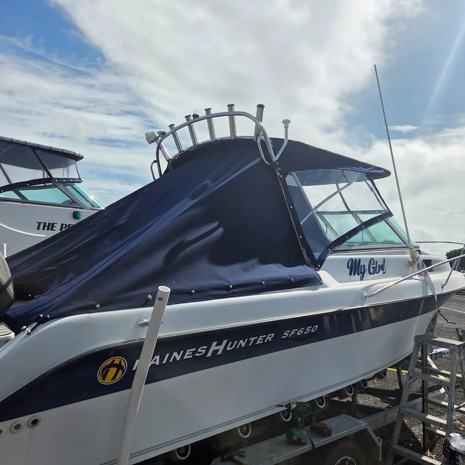 Navy camper cover fitted on a Haines Hunter at the hardstand