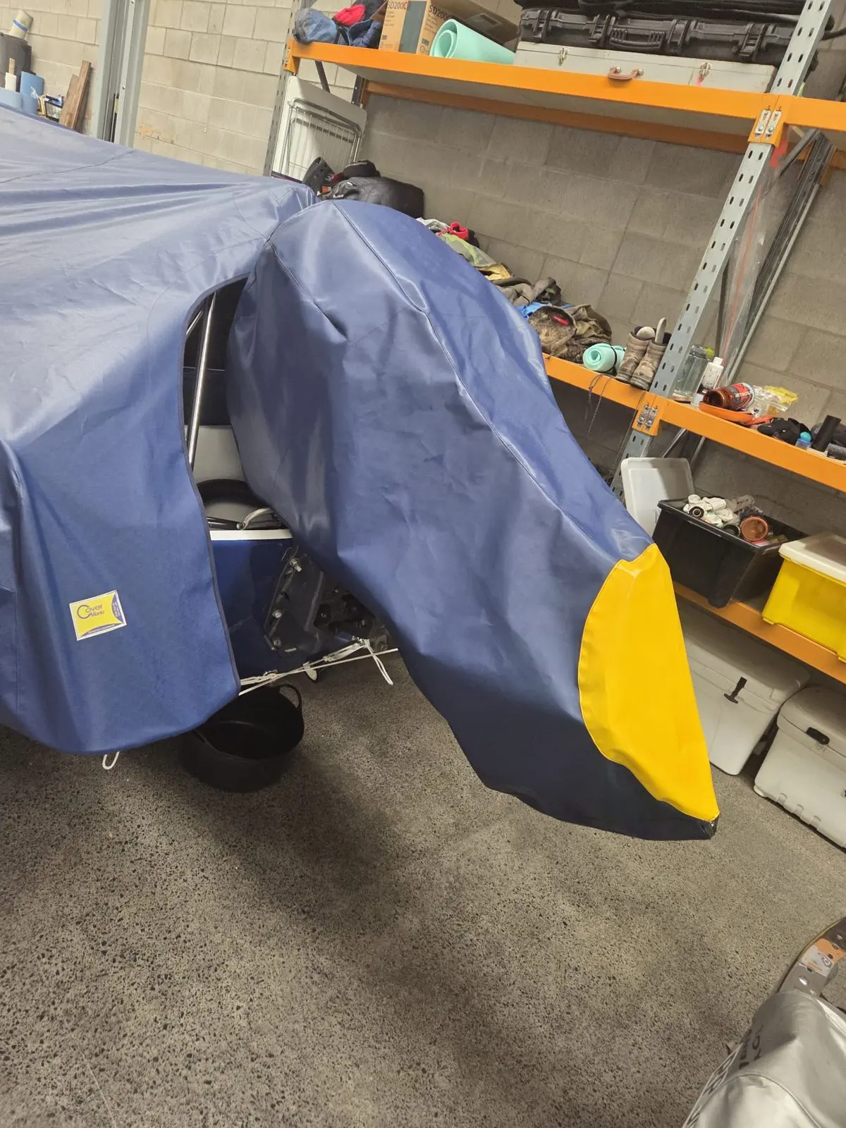 Navy outboard motor covers with yellow-tipped cones