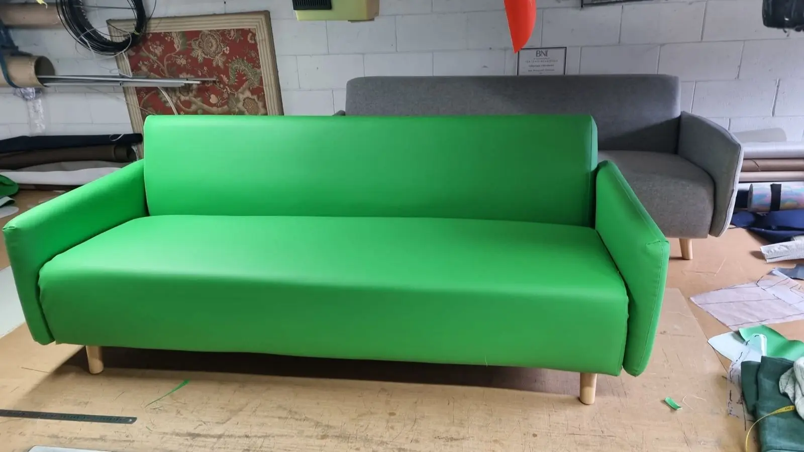 Three-seater sofa recovered in bright green fabric