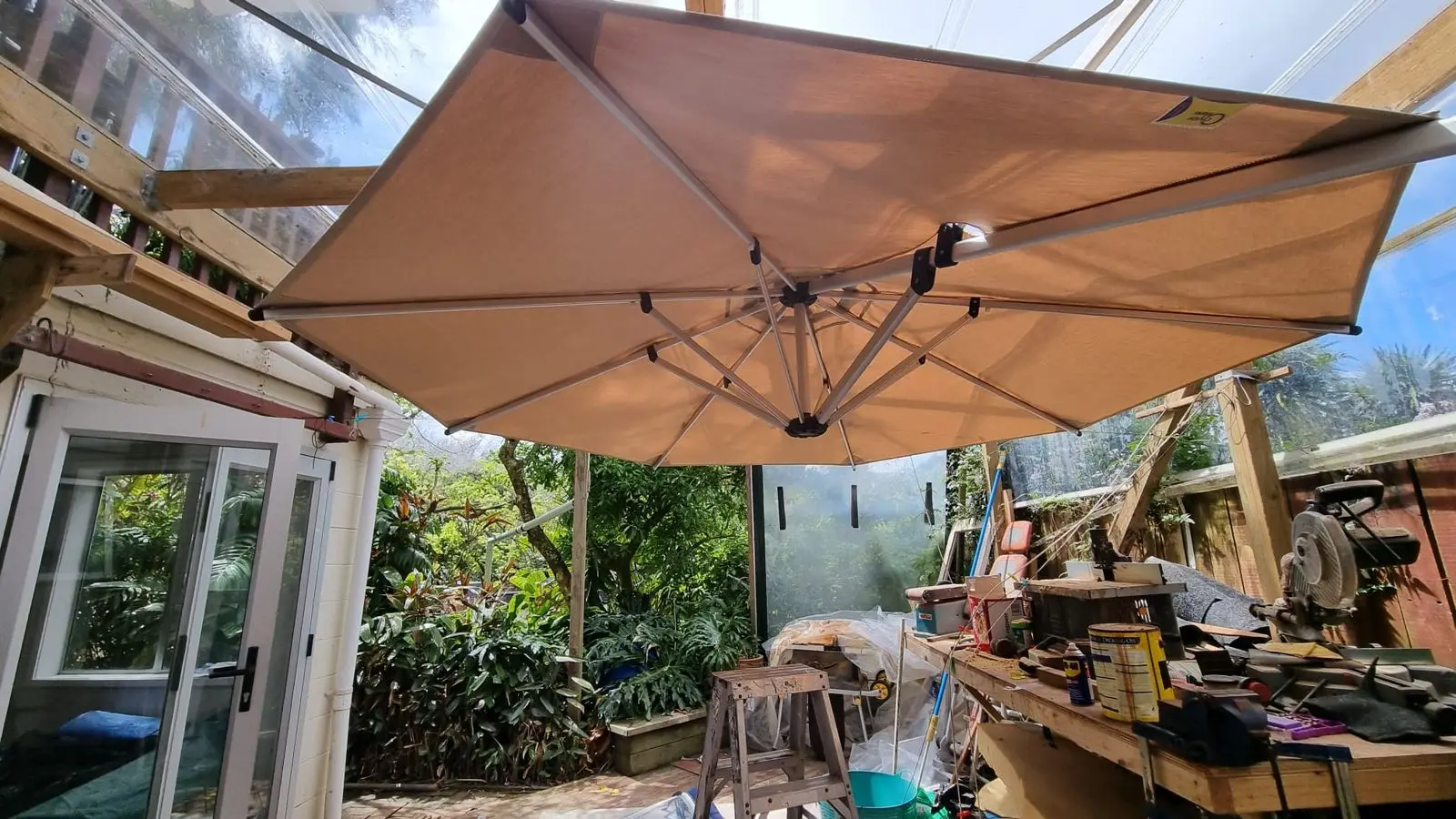 Taupe replacement canopy on a cantilever umbrella